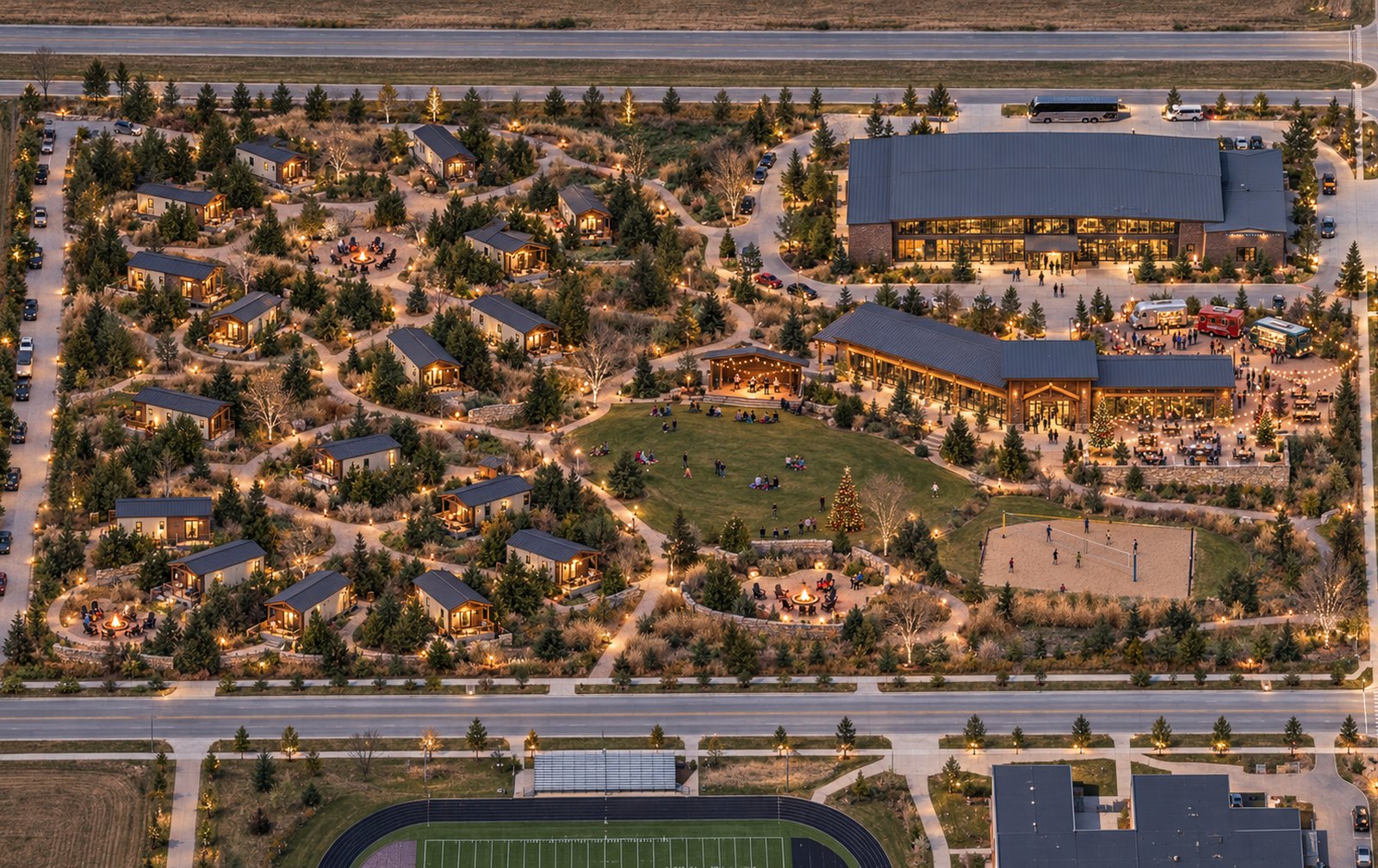 Illustrative aerial concept of a park model destination at dusk: cabins along winding paths, a central lawn and pavilion, lodge building, fire pits and a sand court